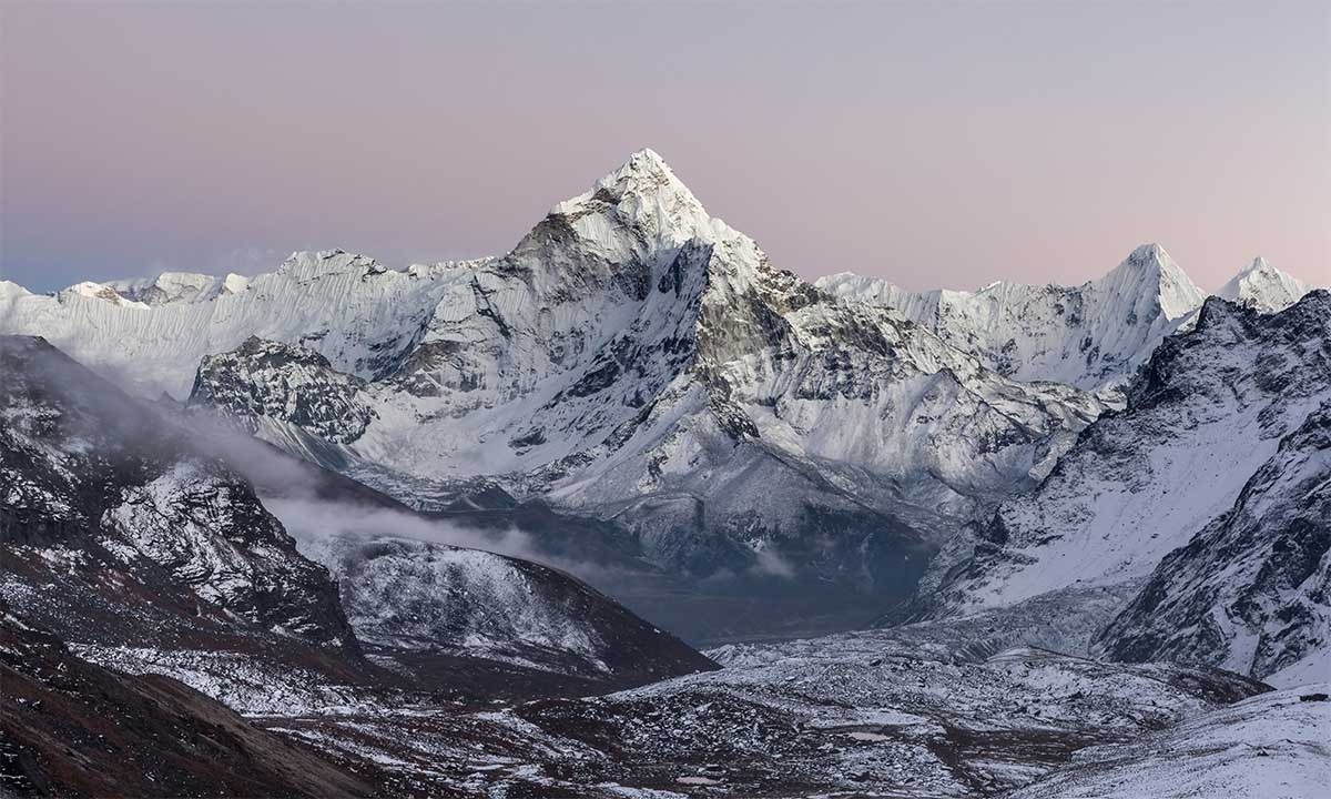 early morning lights over the mountain ama dablam summit on the everest base camp trek